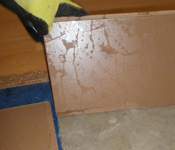a picture of floorboards that water is dripping down