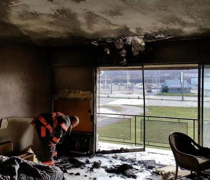 a picture of a hotel room that had a fire
