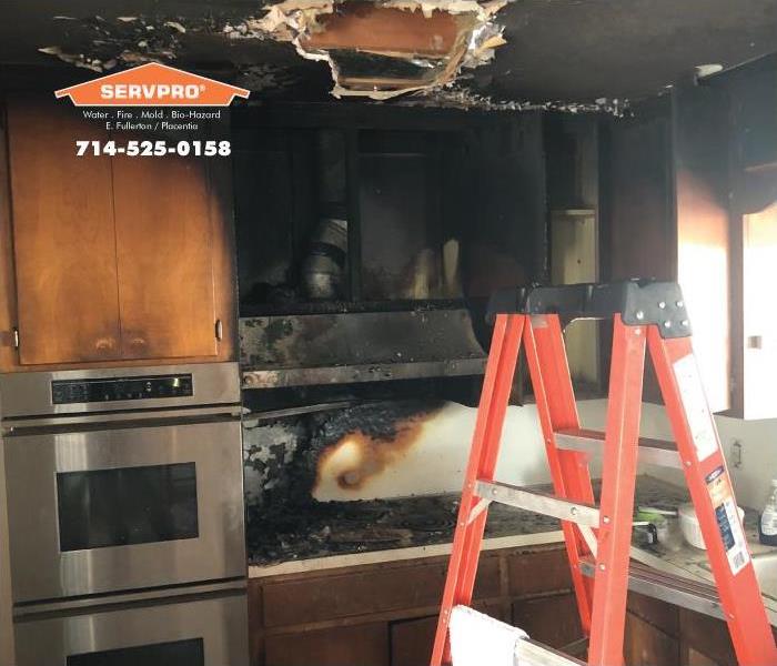 a picture of a kitchen after a fire.