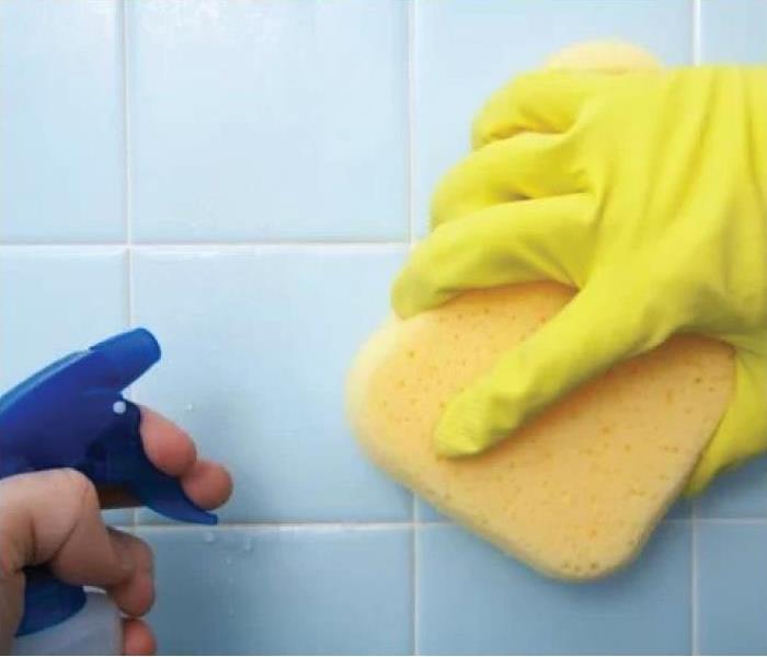 a picture of a someone's hand, cleaning